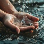 view-realistic-hands-touching-clear-flowing-water-1-560x315